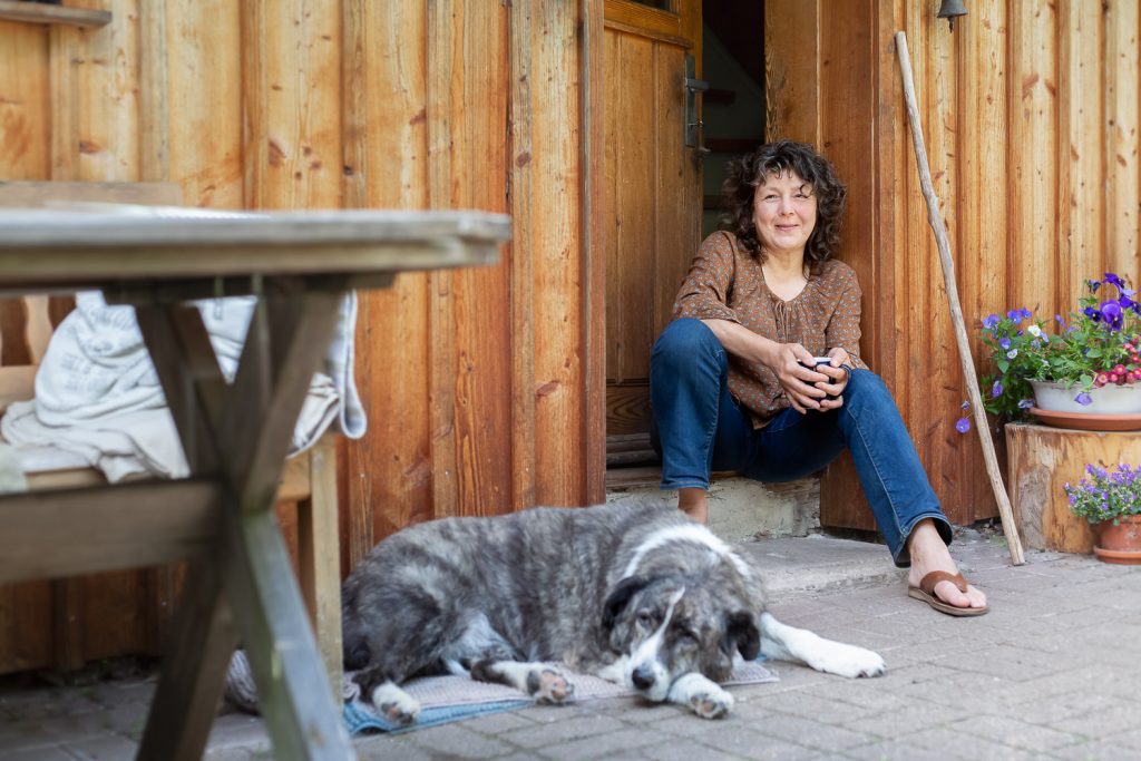 Portrait of woman with her dog, sitting in front of their home , Homepage, Andrea Schenke Photography, Wittlich