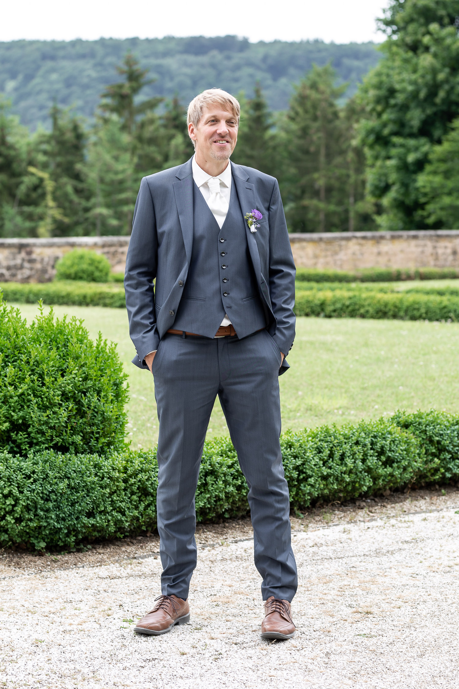 groom standing in the garden of Schloss Weilerbach, Wedding, Hochzeit, Andrea Schenke Photography